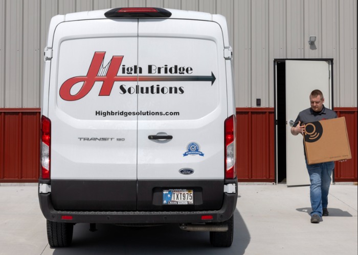 Delivery van with logo and worker carrying box