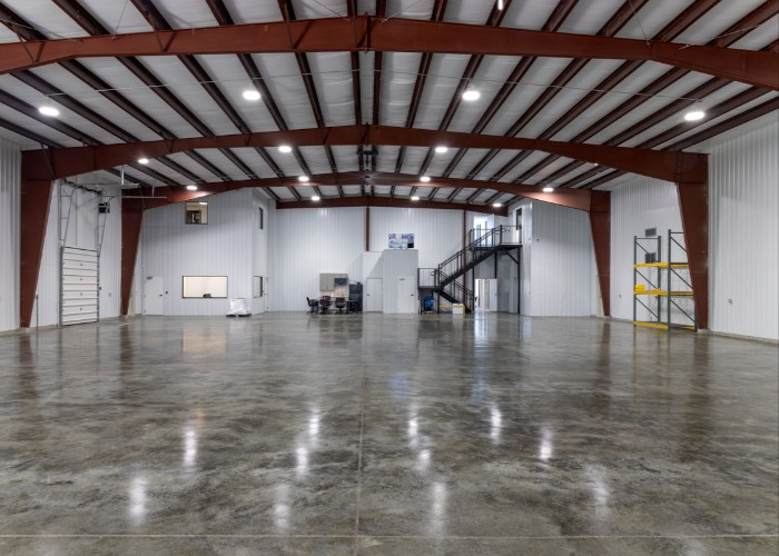 Spacious empty warehouse with polished concrete floor