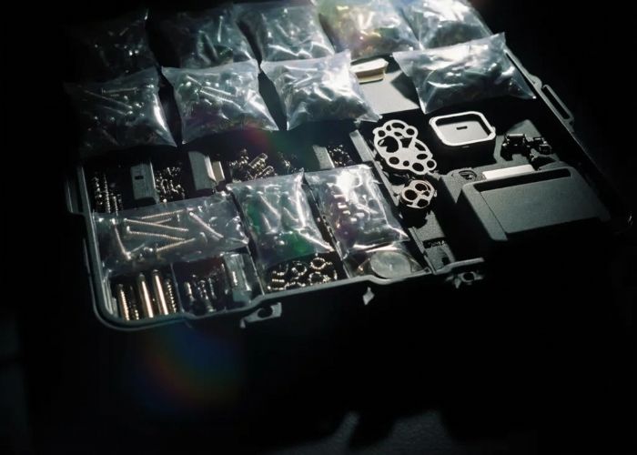 Assorted screws and parts in organizer case