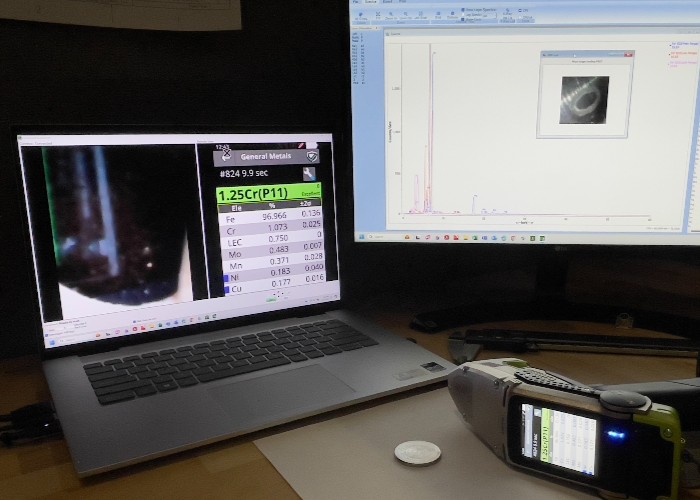 Portable XRF analyzing coin with laptop screens