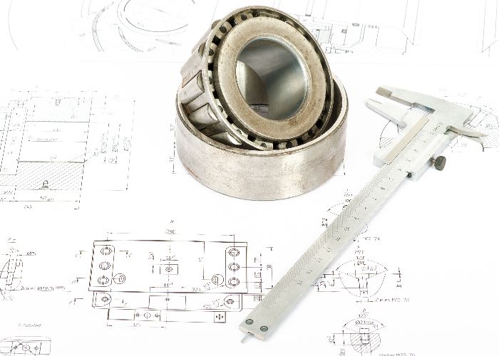 Tapered roller bearing and caliper on blueprint