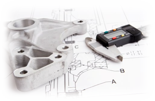 Metal component with caliper on engineering blueprint