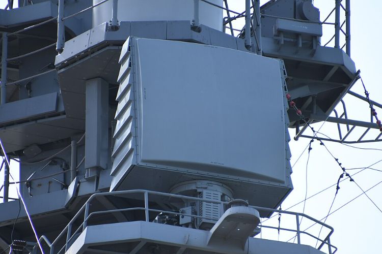 Gray radar housing on naval ship mast