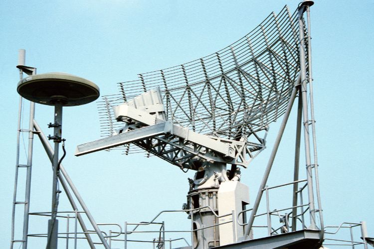 Large parabolic radar antenna on metal tower